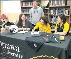  ??  ?? Kieara Bryant, center, signed a letter of intent to become an Ottawa Brave and play softball at Ottawa University in Kansas during a signing ceremony Monday morning in the media center of Pea Ridge High School. Shown with Bryant her her mother, Shannon...