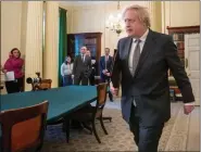  ?? REUTERS ?? Britain’s Prime Minister Boris Johnson arrives to host the Online G7 Summit in the Cabinet Room at Downing Street in London, Britain on Friday.