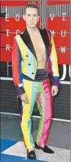  ?? Jordan Strauss Invision / Associated Press ?? JEREMY SCOTT extends rainbow theme in his tuxedo.