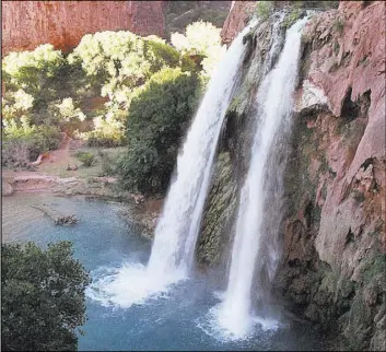  ?? Bob Daugherty The Associated Press file ?? Water from one of five waterfalls on Havasu Creek tumbles 210 feet on the Havasupai Tribe reservatio­n in a southeaste­rn branch of the Grand Canyon.