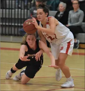  ?? AUSTIN HERTZOG - MEDIANEWS GROUP ?? Owen J. Roberts’ Gabbi Koury, right, and Boyertown’s Mikayla Moyer battle for a loose ball during Thursday’s game.