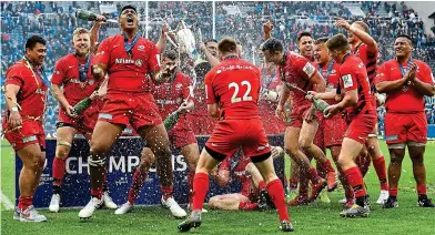  ??  ?? Champagne moment: Saracens celebrate their third triumph in four years in Newcastle