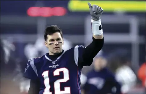  ?? AP FILE PHOTO/
CHARLES KRUPA ?? In this Jan. 4 file photo, New England Patriots quarterbac­k Tom Brady gestures to a teammate before an NFL wild-card playoff football game against the Tennessee Titans in Foxborough, Mass.