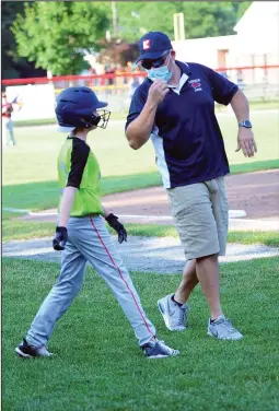  ?? Photos by Ernest A. Brown ?? BOTTOM RIGHT, Tigers batter Will Aiken, left, chats
with team manager T.J. Mellen before batting in the
bottom of the first inning.