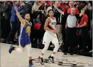  ?? AP PHOTO BY TED S. WARREN ?? Golden State Warriors guard Stephen Curry, left, celebrates as he runs next to Portland Trail Blazers guard CJ Mccollum, center, at the end of Game 4 of the NBA basketball playoffs Western Conference finals, Monday, May 20, in Portland, Ore.