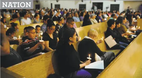  ?? James Durbin / Hearst Newspapers ?? Religious leaders join members of the community for a interfaith vigil to show support for immigrants on March 11 at Our Lady of Guadalupe Catholic Church in Midland, Texas.