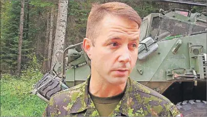  ?? CP PHOTO ?? In this screengrab from video, Lt.-Col. Mason Stalker is interviewe­d as Canadian troops fight fires in Montreal Lake, Sask., July 9. Stalker faces serious, sexrelated charges involving allegation­s that stem from the mentoring of military cadets.