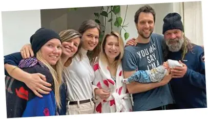  ?? ?? Celebratio­n: Wim Hof with his new grandchild, Kai, his son Enahm and family