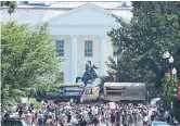  ?? WIN MCNAMEE GETTY IMAGES ?? National Guard vehicles block a street near the White House as protests continue Wednesday.