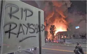  ??  ?? A Wendy’s burns in Atlanta after demonstrat­ors set it on fire Saturday night after the death of Rayshard Brooks.