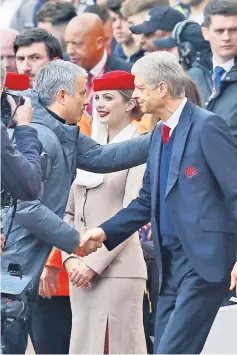  ??  ?? Arsenal’s French manager Arsene Wenger (right) shakes hands with Manchester United’s Portuguese manager Jose Mourinho ahead of the English Premier League football match between Arsenal and Manchester United at the Emirates Stadium in London. — AFP photo