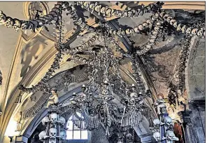  ?? Rick Steves’ Europe/CAMERON HEWITT ?? The Sedlec Bone Church on the outskirts of Kutna Hora incorporat­es the bones of 40,000 victims of wars and plague.