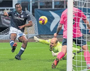  ?? ?? Dundee’s Zach Robinson smashes home his second goal of the game