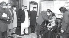  ?? -APP ?? Punjab Chief Minister Sardar Usman Buzdar administer­ing polio drops to a child in CM Office during anti-polio campaign.