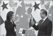  ??  ?? Panama’s Foreign Minister Isabel de Saint Malo, left, and her Chinese counterpar­t Wang Yi raise glasses for a toast after signing a joint communique on establishi­ng diplomatic relations, in Beijing Tuesday.