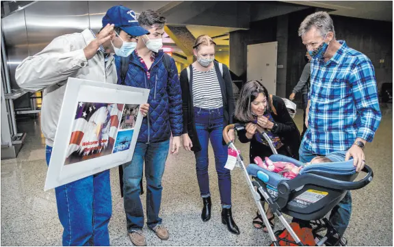  ?? L.E. Baskow Las Vegas Review-journal @Left_eye_images ?? From left, Afghan refugee Benny with Christophe­r Hoffman, his wife, Kristin, parents Ellen and Scott Hoffman and daughter Caroline.