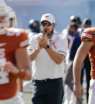  ?? Chuck Burton / Associated Press ?? Tom Herman and Texas planned to be in the Big 12 championsh­ip game before this season. But Iowa State eliminated the Horns from the title chase, and Herman’s job security is in question.