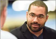  ?? Billy Calzada / San Antonio Express-News ?? John Urschel, a lineman with the Baltimore Ravens and an MIT Ph.D. candidate, meets with people at the National Council of Teachers of Mathematic­s annual meeting and exposition at the Henry B. Gonzalez Convention Center on April 7, 2017.