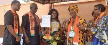  ??  ?? Atuegwu (middle) receiving the Margarette Golding Award from President of the Internatio­nal Inner Wheel Clubs, Mrs. Oluyemisi Alatise