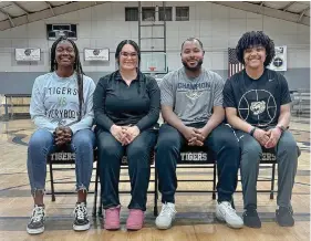  ?? (The Sentinel-Record/Bryan Rice) ?? Members of the Champion Christian College women’s basketball team, from left, junior Brendeja Holloman, assistant coach Hannah Latiolais, head coach DeAnthony Ellison, and junior Makayla Williams sit at midcourt inside the Champion Community Center, Tuesday.