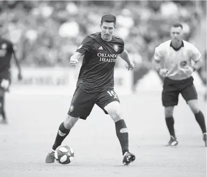  ?? MATT STAMEY/USA TODAY SPORTS ?? Orlando City midfielder Sacha Kljestan, seen moving the ball against the Montreal Impact during last week’s match, thinks the Lions are more effective when they employ a three-centerback formation rather than utilize a four-man back line.