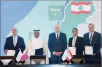  ?? ?? Qatar’s Minister of State for Energy Affairs and President and CEO of QatarEnerg­y HE Saad Sherida Al Kaabi with Lebanon’s Minister of Energy and Water Walid Fayad and other executives