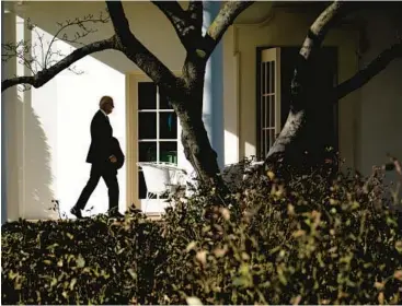  ?? PETE MAROVICH/THE NEW YORK TIMES ?? President Joe Biden walks Monday into the White House after returning on Marine One.