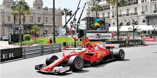  ?? BILD: SN/APA/AFP ?? Ferrari-Pilot Sebastian Vettel hat in diesen Tagen nur wenig Zeit für die Kulisse in Monte Carlo.