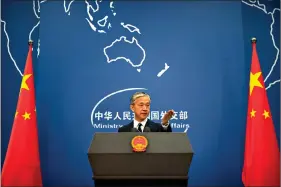  ??  ?? China’s Ministry of Foreign Affairs spokesman Wang Wenbin gestures during a daily briefing at the Ministry of Foreign Affairs on Friday in Beijing. China ordered the United States on Friday to close its consulate in the western city of Chengdu, ratcheting up a diplomatic conflict at a time when relations have sunk to their lowest level in decades. (AP Photo/Mark Schiefelbe­in)