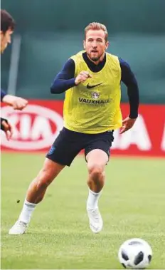  ?? AP ?? England’s Harry Kane goes for the ball as he takes part in a training session in the Spartak Zelenogors­k ground.