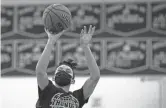  ?? THOMAS HAWTHORNE/THE REPUBLIC ?? Desert Vista’s Jovanni Tapia shoots during practice at Desert Vista High School in Phoenix on Dec. 28.