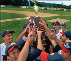  ?? For Montgomery Media / MARK C. PSORAS ?? The Doylestown Tigers hold up their trophy as they celebrate their victory over Spring City for the Pennslyvan­ia American Legion State Championsh­ip at Boyertown on Saturday.