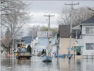  ?? TONY CALDWELL ?? In Gatineau, more than 1,400 flooded properties are in the zone that is considered likely to flood on average every 20 years or more. Most homes in the flood zone are eligible for extensive repairs and cleanup.