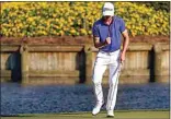  ?? JOHN RAOUX / AP ?? Justin Thomas celebrates after a making a putt on the 17th hole during the final round of The Players Championsh­ip on Sunday in Ponte Vedra Beach, Fla.