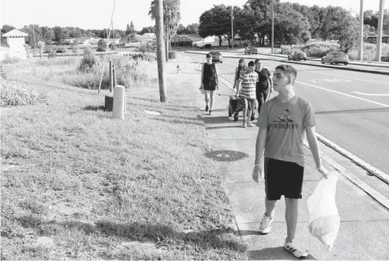  ?? JUAN CARLOS CHAVEZ/TAMPA BAY TIMES ?? Jack Tooley, 15, is autistic. His mother, Maria “Lalita” Tooley, says walking outdoors has improved her son’s personalit­y and attitude.