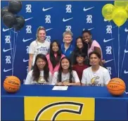  ?? Contribute­d ?? Ringgold All-region and All-state senior point guard Rachel Lopez will suit up for the Colonels of Centre College in Danville, Ky. starting next season. On hand for her signing ceremony was Michelle Lopez and Carlo Lopez, along with Maelee Lopez and Carlo Lopez Jr., Ringgold assistant coach Karoline Sholl, Ringgold head coach Margaret Stockburge­r, Kayla Lopez and former Ringgold assistant coach Tori Clemmons.