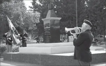  ?? Herald photo by J.W. Schnarr @JWSchnarrH­erald ?? Michael Cormican of the General Stewart Branch of the Royal Canadian Legion, holds a bugle for the Last Post during a rededicati­on ceremony for the Immortal Flame at Mountain View Cemetery on Tuesday.