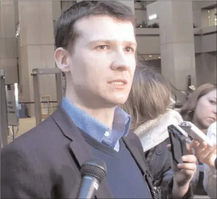  ?? The Canadian Press ?? Calgary city councillor Jeromy Farkas speaks to reporters in Calgary on Thursday, Jan. 11, 2018 after the city cancelled a controvers­ial nude swimming event.