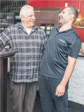  ?? ANDREW FRANCIS WALLACE PHOTOS TORONTO STAR ?? Sam Azar, left, and son Nabil, share a laugh at Sababa, which opened in 1987.