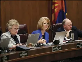  ??  ?? Arizona state senator Heather Carter speaks as senators Kate Brophy-McGee (left) and Rick Gray (right) listen as they meet in committee to discuss health care oversight on Wednesday, at the Capitol in Phoenix. AP PHOTO MATT YORK