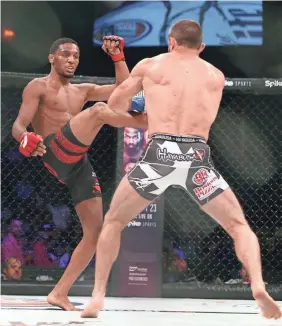  ?? DAVE MANDEL/USA TODAY SPORTS ?? A.J. McKee, left, defeated Blair Tugman during Bellator 182 last year en route to compiling an 11-0 record.