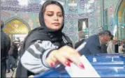  ?? REUTERS ?? ■
A woman casts her vote during parliament­ary elections at a polling station in Tehran.