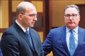  ?? Jim Shannon / Associated Press file photo ?? State Police officer Sgt. John McDonald, left, appeared in state Superior Court in Middletown with his attorney Robert Britt in Middletown­on Jan. 27, 2020.