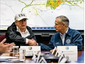  ?? DOUG MILLS / NEW YORK TIMES ?? President Donald Trump (left) shakes hands with Texas Gov. Greg Abbott on Tuesday at the state’s command center for the response to Hurricane Harvey on North Lamar Boulevard. Trump’s visit was his first to the state as president.