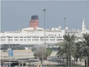  ?? Antonie Robertson / The National ?? The decommissi­oned Queen Elizabeth 2 cruise ship, moored in Port Rashid, appears set for a new lease of life