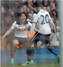  ?? AP ?? Tottenham Hotspur’s Son Heung-min and Dele Alli celebrate a goal against Bournemout­h during a Premier League match. —