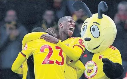  ??  ?? Watford players and mascot Harry the Hornet celebrate a goal at Vicarage Road this season.