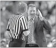  ?? AP/BRAD TOLLEFSON ?? Texas Tech Coach Chris Beard makes his point with a referee during the Red Raiders’ 72-71 victory over No. 2 West Virginia on Saturday in Lubbock, Texas.