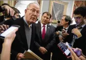  ?? ANDREW HARNIK / ASSOCIATED PRESS ?? Sen. Lamar Alexander (left), R-Tenn., accompanie­d by Sen. Mike Rounds (center), R-S.D., speaks to reporters Tuesday in Washington after he and Sen. Patty Murray, D-Wash., reached a bipartisan deal to resume payments to insurers that President Donald...