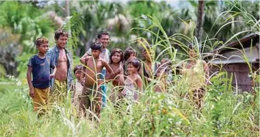  ?? Foto: dpa ?? Mitglieder einer indigenen Gemeinscha­ft in der Region Alto Rio Negro (Brasilien).